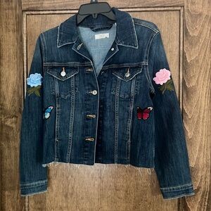 Levi girls large jean jacket with patches. Never worn.